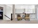 This loft features a sitting area with two chairs and views to a lower level at 13613 Lake Ridge Ln, McCordsville, IN 46055