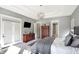 Bright main bedroom boasts trey ceiling, pendant lighting, and a dark wood dresser at 13613 Lake Ridge Ln, McCordsville, IN 46055