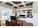 Bright office space with custom built-in shelving and large window overlooking the yard at 13613 Lake Ridge Ln, McCordsville, IN 46055