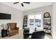Office space with large window with waterfront view, tufted chair, and built in shelving at 13613 Lake Ridge Ln, McCordsville, IN 46055