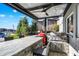Outdoor kitchen equipped with a built-in grill and bar seating at 13613 Lake Ridge Ln, McCordsville, IN 46055