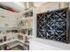 Well-organized pantry with shelving for storing beverages and other kitchen necessities at 13613 Lake Ridge Ln, McCordsville, IN 46055