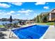 Covered outdoor pool with lush backyard space and lakeside views at 13613 Lake Ridge Ln, McCordsville, IN 46055