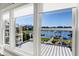 Beautiful waterfront view through windows, showcasing the landscape and docks at 13613 Lake Ridge Ln, McCordsville, IN 46055