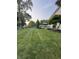 Expansive backyard featuring lush green grass, a playground, and a pristine white deck at 1378 Runningbrook Dr, Avon, IN 46123