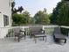 Cozy outdoor deck with comfortable wicker furniture to enjoy the surrounding nature at 1378 Runningbrook Dr, Avon, IN 46123