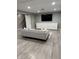 Finished basement with ample storage, a large screen TV and cozy seating area at 1378 Runningbrook Dr, Avon, IN 46123