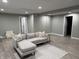Finished basement with neutral walls, recessed lighting, sectional couch, and decorative rug at 1378 Runningbrook Dr, Avon, IN 46123
