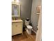 Half bathroom with stylish vanity, fixtures, and a wall decoration at 1378 Runningbrook Dr, Avon, IN 46123