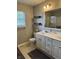 Well-lit bathroom features a modern sink with brushed-metal fixtures and a glass shower enclosure at 1378 Runningbrook Dr, Avon, IN 46123