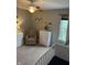 A Bedroom with a neutral rocking chair, white dresser, and crib, showcasing natural light and a cozy atmosphere at 1378 Runningbrook Dr, Avon, IN 46123