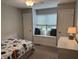 Bedroom with a window seat, pillows, natural light, neutral walls, and carpet at 1378 Runningbrook Dr, Avon, IN 46123