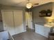 A view of a Bedroom with a white closet, dresser, and crib, showcasing a clean and inviting space at 1378 Runningbrook Dr, Avon, IN 46123