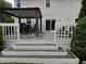 Outdoor deck area featuring a pergola, dining set, and comfortable seating for relaxation and entertainment at 1378 Runningbrook Dr, Avon, IN 46123