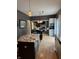Stylish kitchen with island, granite countertops, and open dining area at 1378 Runningbrook Dr, Avon, IN 46123
