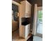 Charming dry bar with white cabinets and wine storage, conveniently located near the living area at 1378 Runningbrook Dr, Avon, IN 46123