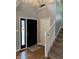Inviting entryway featuring a staircase, black front door, and clean white trim at 1378 Runningbrook Dr, Avon, IN 46123