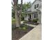 Charming home featuring a well-maintained front yard with lush landscaping and a welcoming walkway at 1378 Runningbrook Dr, Avon, IN 46123