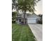 Beautiful two-story home with lush green lawn, mature landscaping, and a welcoming front porch at 1378 Runningbrook Dr, Avon, IN 46123