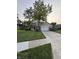 Well-maintained two-story home with a spacious front yard, mature trees, and a paved driveway at 1378 Runningbrook Dr, Avon, IN 46123
