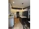 Modern kitchen with white cabinets, granite countertops, and stainless steel appliances at 1378 Runningbrook Dr, Avon, IN 46123