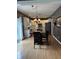 Modern kitchen featuring white cabinetry, granite countertops, and connected dining area at 1378 Runningbrook Dr, Avon, IN 46123