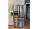 Stainless steel refrigerator with water dispenser in a modern kitchen with white cabinetry at 1378 Runningbrook Dr, Avon, IN 46123