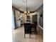 Contemporary kitchen with white cabinets, granite countertops, and adjacent dining area at 1378 Runningbrook Dr, Avon, IN 46123
