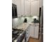 Bright kitchen features granite counters, modern appliances, and white cabinets at 1378 Runningbrook Dr, Avon, IN 46123
