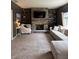 Inviting living room with stone fireplace, floating shelves, and comfortable seating at 1378 Runningbrook Dr, Avon, IN 46123