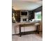 Cozy living room showcasing a stone fireplace, built-in shelving, and comfortable seating at 1378 Runningbrook Dr, Avon, IN 46123