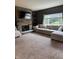 Inviting living room with stone fireplace, built-in shelves, and a comfortable sectional sofa at 1378 Runningbrook Dr, Avon, IN 46123