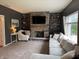 Cozy living room features a stone fireplace, built-in shelves, and comfortable seating area at 1378 Runningbrook Dr, Avon, IN 46123