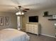 Spacious main bedroom features a ceiling fan, flat-screen television, and en-suite bathroom at 1378 Runningbrook Dr, Avon, IN 46123