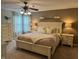 Comfortable main bedroom features a ceiling fan, neutral color scheme, and carpeted floors at 1378 Runningbrook Dr, Avon, IN 46123