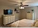Comfortable main bedroom features a ceiling fan, flat-screen television, and carpeted floors at 1378 Runningbrook Dr, Avon, IN 46123
