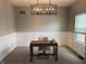 Well-lit office space with modern chandelier and ample natural light from the window at 1378 Runningbrook Dr, Avon, IN 46123