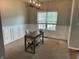 Bright office space with large window, desk and chair, perfect for a home office setup at 1378 Runningbrook Dr, Avon, IN 46123