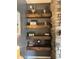 Rustic wooden shelves with decorative items, complementing the adjacent stone fireplace at 1378 Runningbrook Dr, Avon, IN 46123