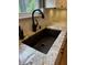 Kitchen sink area with modern faucet, granite counters, and herringbone tile backsplash at 1378 Runningbrook Dr, Avon, IN 46123
