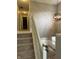 Elegant staircase features neutral carpet and gives view of entry area with seating at 1378 Runningbrook Dr, Avon, IN 46123