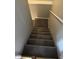 Carpeted staircase leading to the upper level of the home at 1378 Runningbrook Dr, Avon, IN 46123