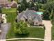 Expansive home with a pool, playground, and lush landscaping at 13888 Smokey Ridge Dr, Carmel, IN 46033