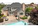 Spacious backyard featuring a beautiful pool and patio area for outdoor entertaining at 13888 Smokey Ridge Dr, Carmel, IN 46033