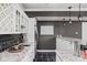 Basement bar area with marble countertops, stainless steel appliances, sink, and white cabinets with modern fixtures at 13888 Smokey Ridge Dr, Carmel, IN 46033