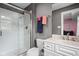 Bathroom with a glass door shower, white vanity, modern faucet and matching accessories providing a spa-like experience at 13888 Smokey Ridge Dr, Carmel, IN 46033