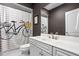 Bathroom featuring white vanity, a framed mirror, and a decorative shower curtain at 13888 Smokey Ridge Dr, Carmel, IN 46033
