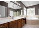 Bathroom features a dual sink vanity, soaking tub, and a separate glass shower at 13888 Smokey Ridge Dr, Carmel, IN 46033