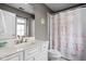 Charming bathroom featuring vanity and a unique shower curtain at 13888 Smokey Ridge Dr, Carmel, IN 46033