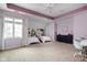 Bright bedroom features a ceiling fan, two beds and a spacious layout at 13888 Smokey Ridge Dr, Carmel, IN 46033